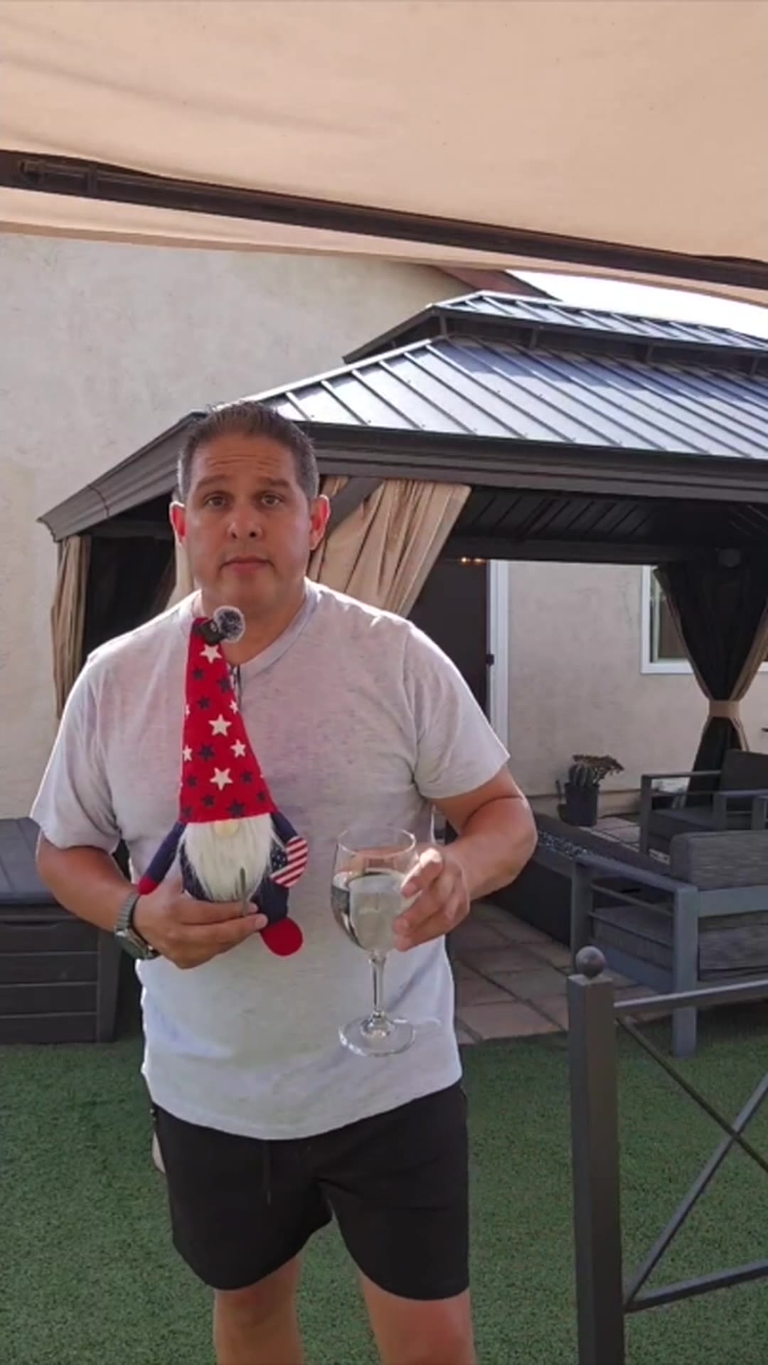 John on day 10 of the 90 day water fast, holding the gnome and a glass of water