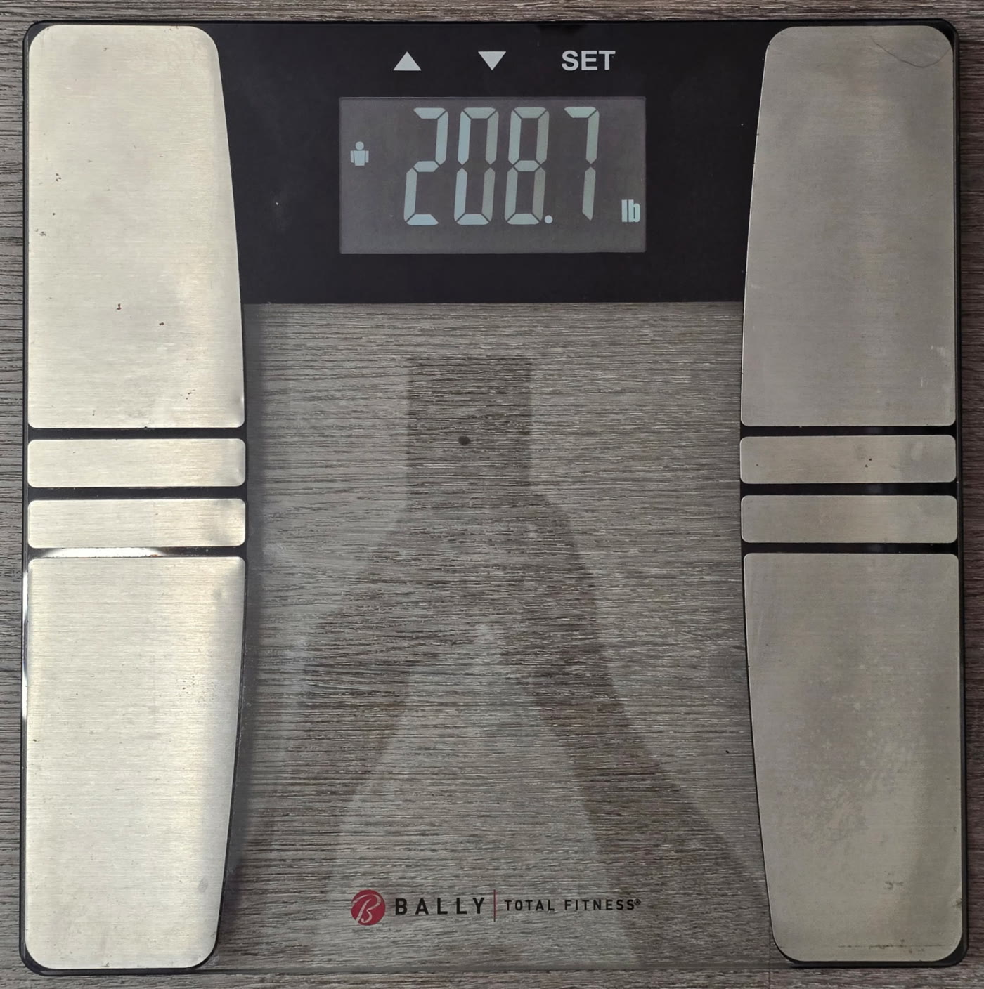 Bathroom scale on the morning of day 10 of the water fast reading 208.7 pounds